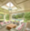 Covered garden pavilion with a rooflight and hanging lantern