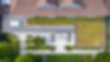 Aerial view of a home extension with a planted roof and terrace