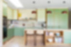 A modern, well-lit kitchen extension with an island and dining area