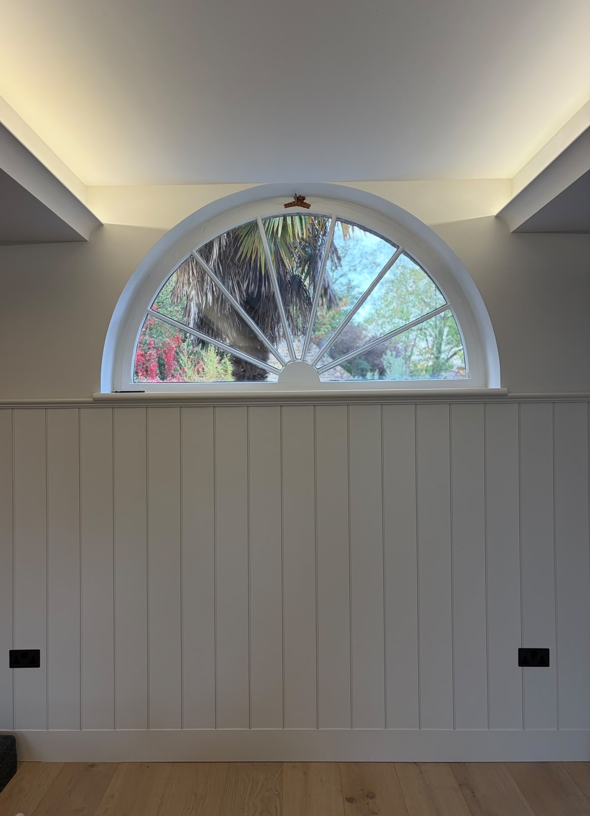 Retained arched window and refurbished timber panelling after the West Side Common renovation